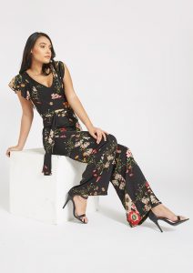 Madison modeling the Lexington Floral Jumpsuit